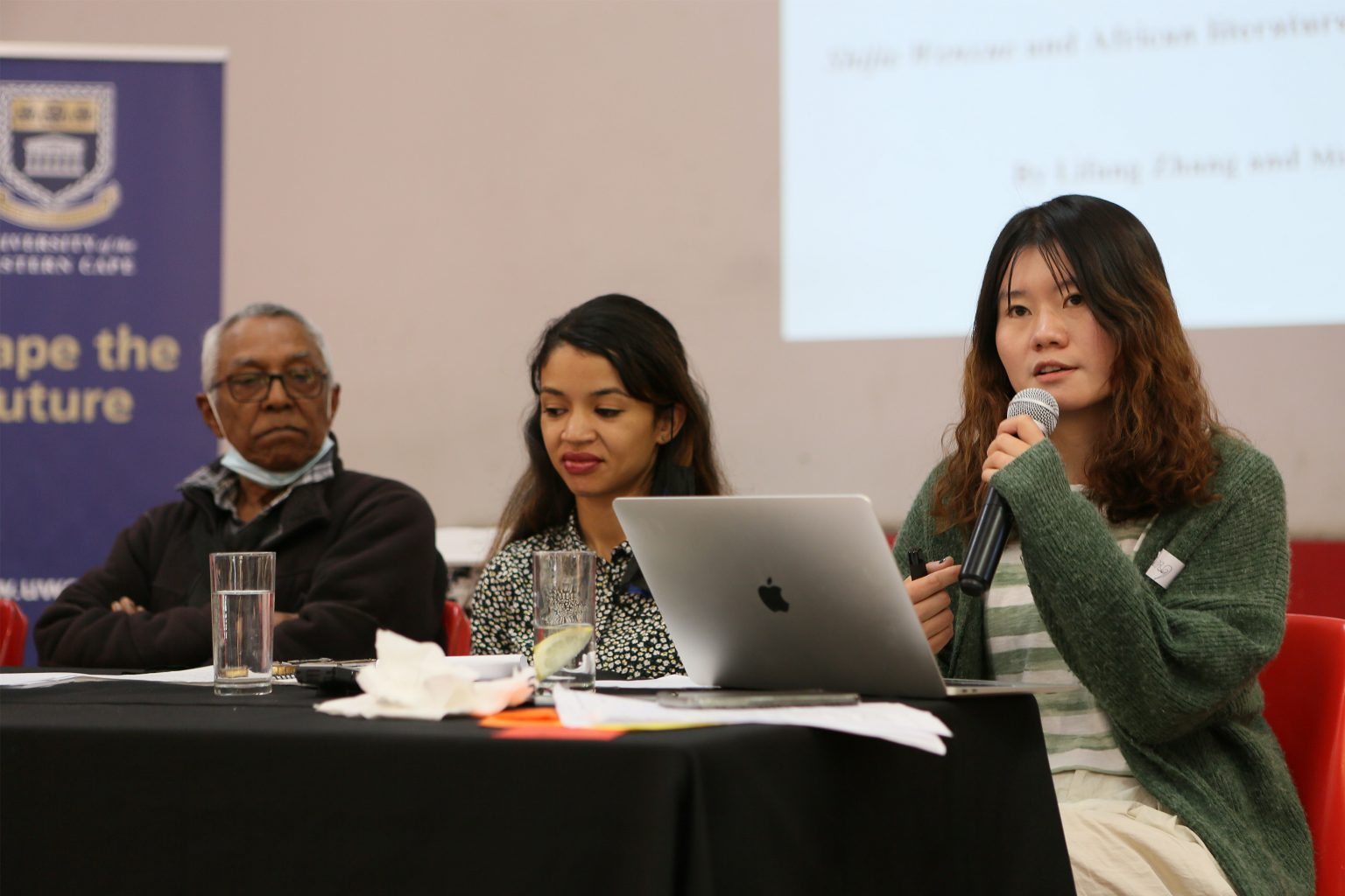 Photo of Lifang Zhang answering a question from the room.